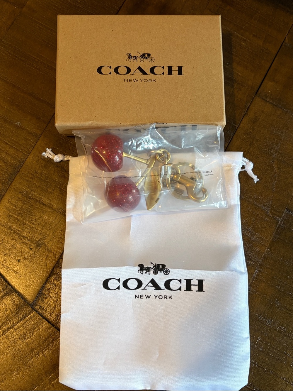Coach Red Cherry Bag Charm and Keychain with Gold Hardware.  Brand new!